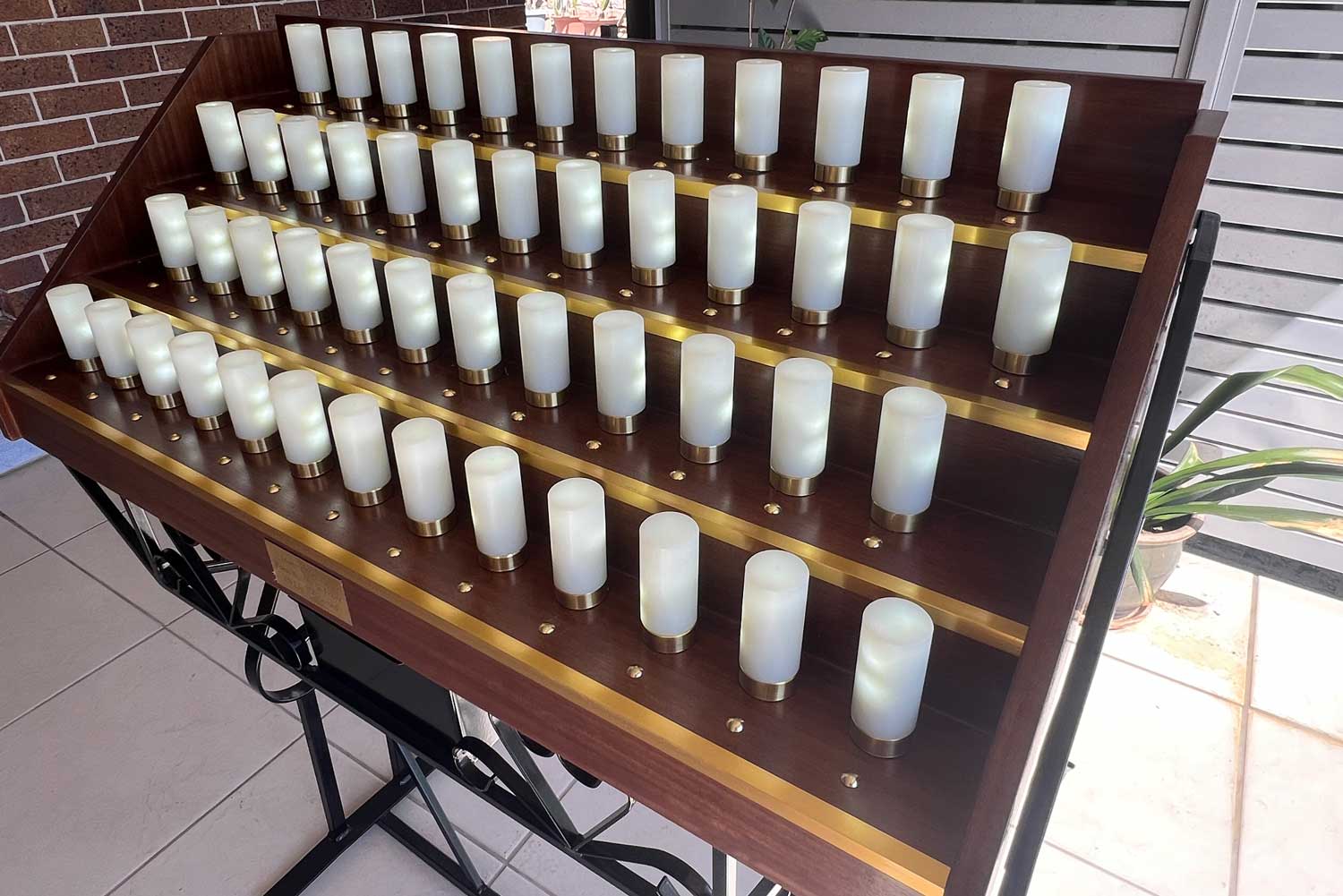 Kerry Oil Candles Sale stand photographed in outdoor setting