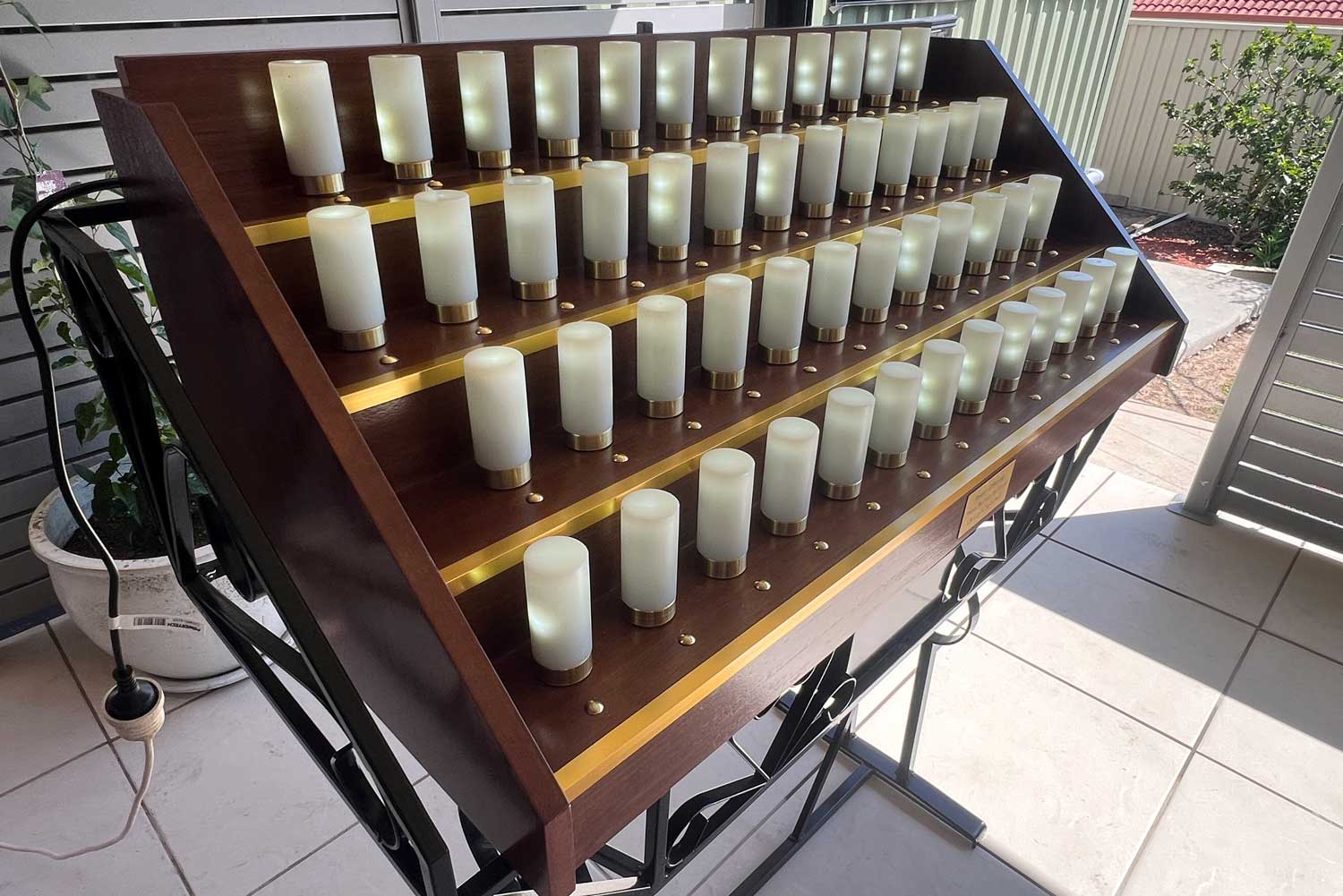 Kerry Oil Candles Sale stand photographed in outdoor setting