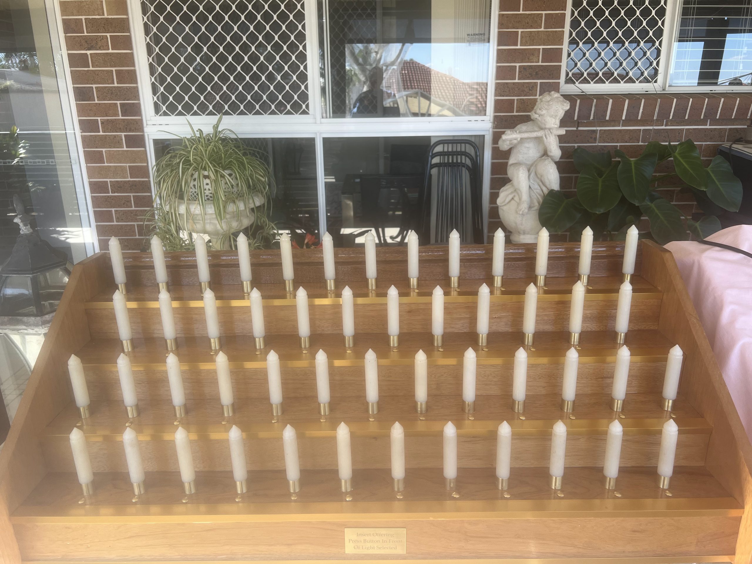 Reconditioned 50-light votive candle stand with revarnished woodwork and gold anodised trim